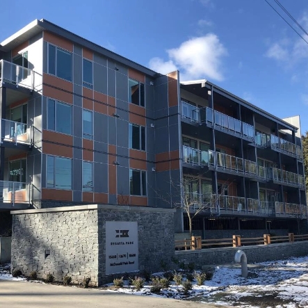 apartment building with sign out front